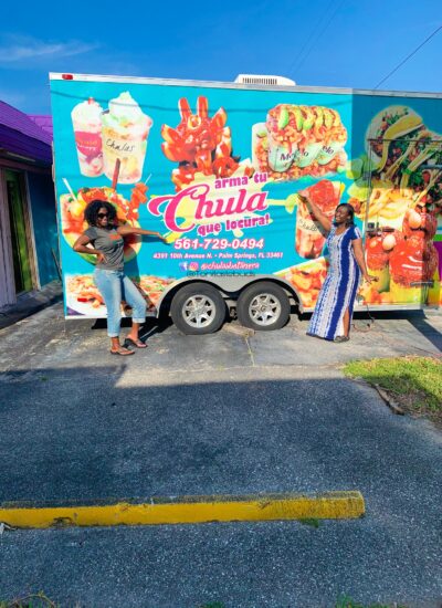 Toni Girls standing in front of Mexican food truck